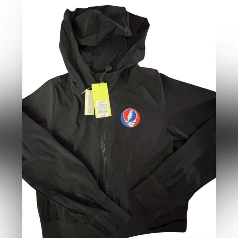 New- kids Large nylon rain jacket 
Black Hooded drawstring, Grateful Dead logo